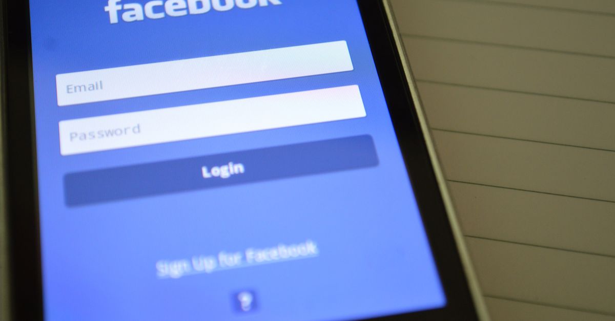 Mobile phone with Facebook login screen, highlighting digital connectivity and social media use.